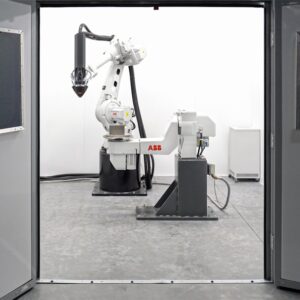 Large-format additive manufacturing equipment. Photo by Hermeus on Unsplash.