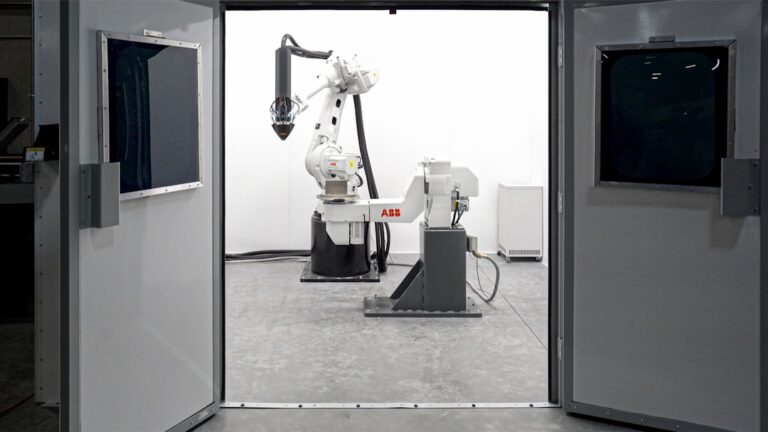 Large-format additive manufacturing equipment. Photo by Hermeus on Unsplash.