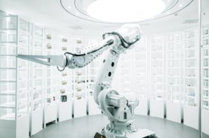 White robotic arm in a modern technology laboratory. Photo by ZHENYU LUO on Unsplash.