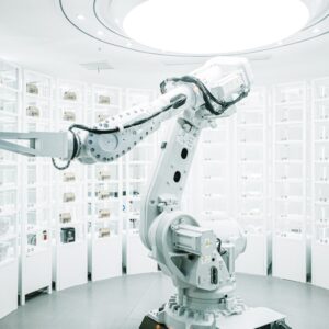 White robotic arm in a modern technology laboratory. Photo by ZHENYU LUO on Unsplash.
